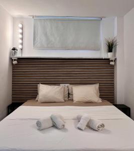 a bedroom with a bed with two towels on it at Yumbo Sunset Suite Tanife - Next to Yumbo in Playa del Ingles