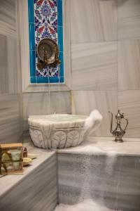 a bath tub in a bathroom with a window at Best Point Hotel Sultanahmet,Istanbul in Istanbul +61 photos