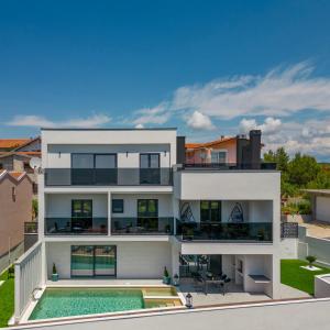 an aerial view of a house with a swimming pool at Villa Depaja ZadarVillas in Zadar