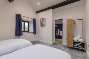 En eller flere senge i et værelse på Manor