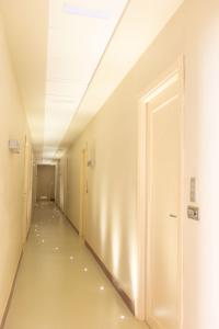 a corridor of an empty room with a door at Lungomare Suite & Spa in Naples