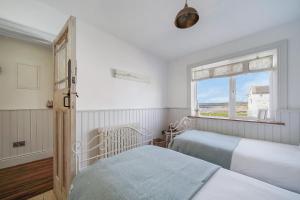Ένα ή περισσότερα κρεβάτια σε δωμάτιο στο Susans Beach House