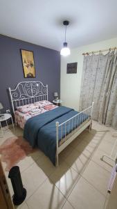 Ένα ή περισσότερα κρεβάτια σε δωμάτιο στο Galini Apartments