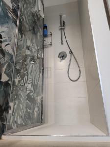 a shower with a shower head in a bathroom at 33 Joy Dreams in Sandra