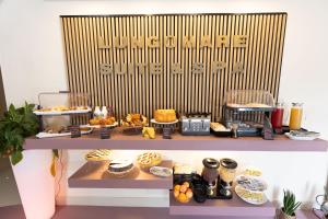 a bakery with a buffet of food on a shelf at Lungomare Suite & Spa in Naples