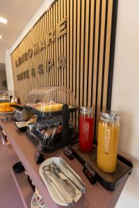 a table with utensils and drinks on a counter at Lungomare Suite & Spa in Naples