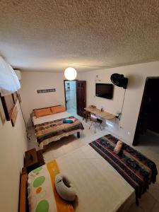 Una cama o camas en una habitación de KoKoRoom Samaria - a 100mts de playa