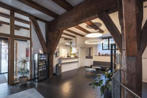 an open living room with wooden ceilings and wooden beams at Jugendherberge Dinkelsbühl - Youth Hostel in Dinkelsbühl
