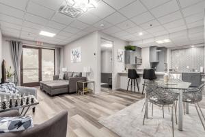 a living room with a couch and a table at Stylish and Prestigious - 2 Bed, 2 Bath On The Avenue in Fountain Hills