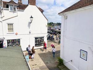 a group of people standing outside of a building at LB Newgate in Lymington