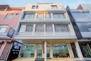 a store front of a building with windows at HOTEL SKY VIEW - Zirakpur, Chandigarh in Zirakpur