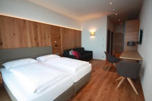 Posteľ alebo postele v izbe v ubytovaní Berghotel Schmittenhöhe - 2000m