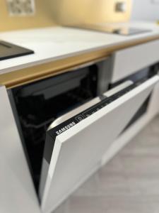 Køkken eller tekøkken på Apartament 606 - PORTA MARE - z widokiem na morze