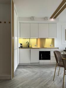 Køkken eller tekøkken på Apartament 606 - PORTA MARE - z widokiem na morze