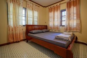 Postel nebo postele na pokoji v ubytování บ้านอัคคนี-Baan AUCKANEE + 22 fotografií