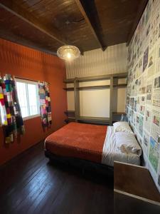 Una cama o camas en una habitación de The Host Puerto Iguazú