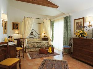 Postel nebo postele na pokoji v ubytování Fattoria La Principina Hotel & Congress