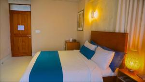 Postel nebo postele na pokoji v ubytování Dream Inn PR