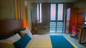 Postel nebo postele na pokoji v ubytování Dream Inn PR