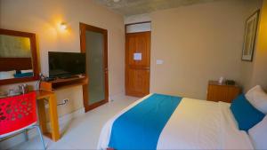 Postel nebo postele na pokoji v ubytování Dream Inn PR