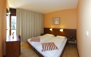 Postel nebo postele na pokoji v ubytování Hotel Donat - All Inclusive