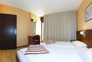 Postel nebo postele na pokoji v ubytování Hotel Donat - All Inclusive