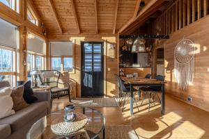 a living room with a couch and a table at 3BR Cabin in the Middle of Golden Circle in Selfoss