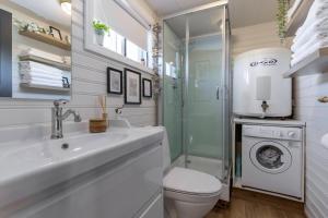 a bathroom with a sink and a toilet and a shower at 3BR Cabin in the Middle of Golden Circle in Selfoss +10 photos