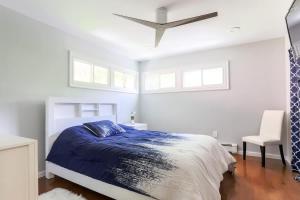 a bedroom with a bed and a ceiling fan at Relaxation Retreat Home with Hot Tub Gym & Sauna in Prattsville