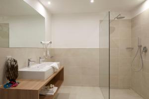 a bathroom with a sink and a shower at Residence Ladurn in Tirolo +44 photos
