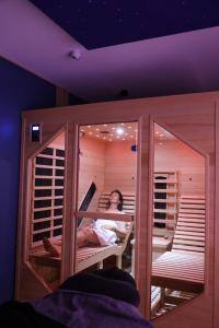 Postel nebo postele na pokoji v ubytování Maison Dix Chambres d'hôtes et Espace SPA Bien être