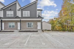 a large house with a parking lot in front of it at Waiting to Excell in Clarksville +11 photos