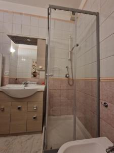a bathroom with a shower and a sink at Casa Marina in Tortolì