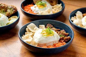 a group of bowls of food on a table at Anex Hotel near Roxas Boulevard in Manila