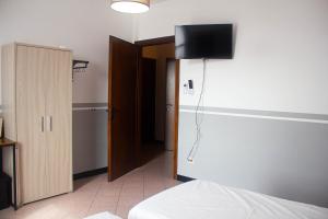 Postel nebo postele na pokoji v ubytování Camere della Perla