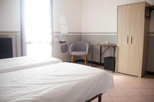 Postel nebo postele na pokoji v ubytování Camere della Perla