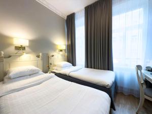 Postel nebo postele na pokoji v ubytování Best Western Hotel Bentleys