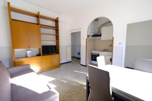 a room with a kitchen and a living room at Casa Guastone by PortofinoVacanze in Rapallo +11 photos