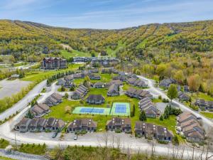 an aerial view of a residential complex with a large park at Windham Mountain Village Condo in Windham
