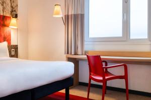 Postel nebo postele na pokoji v ubytování B&B HOTEL Mons Gare