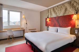 Postel nebo postele na pokoji v ubytování B&B HOTEL Mons Gare