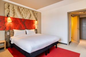 Postel nebo postele na pokoji v ubytování B&B HOTEL Mons Gare