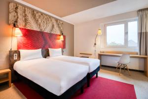 Postel nebo postele na pokoji v ubytování B&B HOTEL Mons Gare