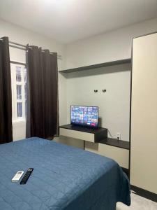 Televisyen dan/atau pusat hiburan di Apartamento Completo Centro