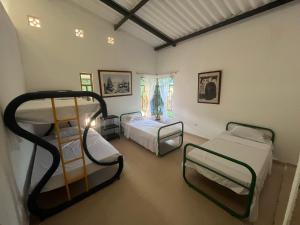 Postel nebo postele na pokoji v ubytování Hostal Macayaco + 37 fotografií