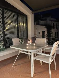 a white table and chairs on a patio at Casa pintora Neus in Cadaqués +14 photos