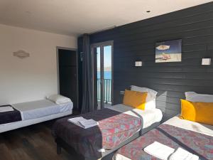 Postel nebo postele na pokoji v ubytování Hôtel A RENA D'ORU