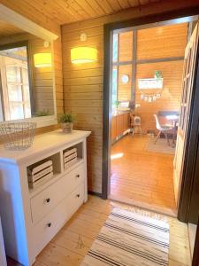 a room with a door leading to a dining room at Chalet 22 Bernau in Bernau im Schwarzwald