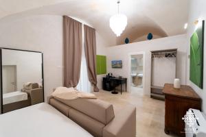 Postel nebo postele na pokoji v ubytování Casa Philomena - Noto Design Rooms