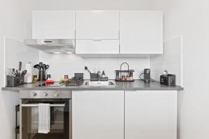 Η κουζίνα ή μικρή κουζίνα στο Wohlfühl-Apartment I Zentral I Balkon I Küche